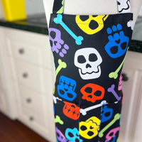 A Bright and Kooky Kid's Apron Covered in Bones