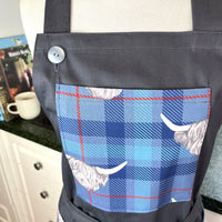 Highland Cows Make this Grey Apron Stand Out this Father's Day