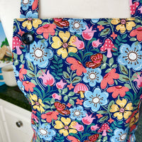Hunt for the Adorable Butterflies and Mushrooms Within this Lovely Floral Apron