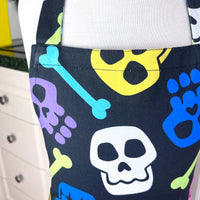 A Bright and Kooky Kid's Apron Covered in Bones