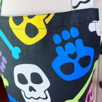 A Bright and Kooky Kid's Apron Covered in Bones