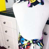 A Bright and Kooky Kid's Apron Covered in Bones