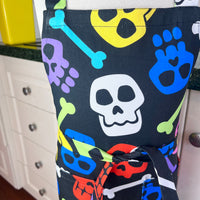 A Bright and Kooky Kid's Apron Covered in Bones