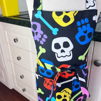 A Bright and Kooky Kid's Apron Covered in Bones