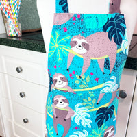 This Toddler's Apron is Covered in the Cutest Sloths