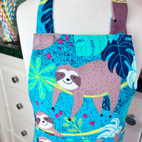 This Toddler's Apron is Covered in the Cutest Sloths