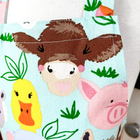 This Toddler's Apron is Covered in All Kinds of Cute Animals