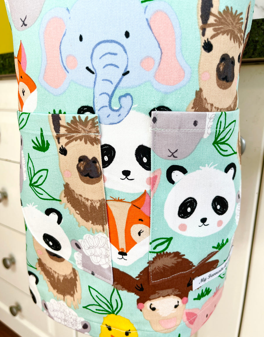 This Toddler's Apron is Covered in All Kinds of Cute Animals