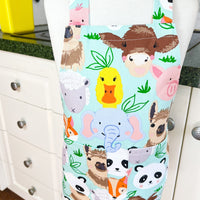 This Toddler's Apron is Covered in All Kinds of Cute Animals