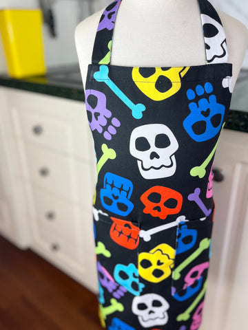 A Bright and Kooky Kid's Apron Covered in Bones