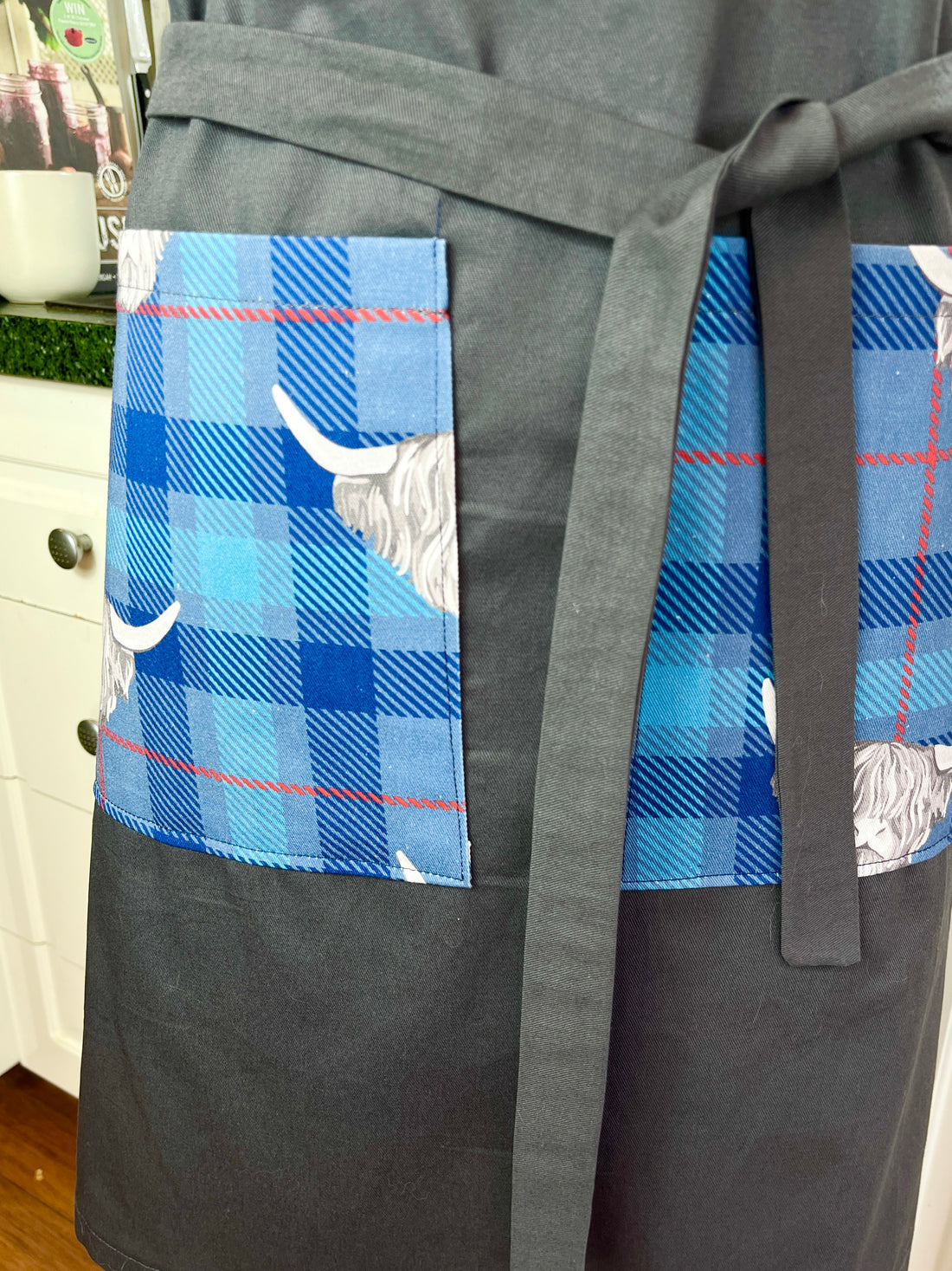 Highland Cows Make this Grey Apron Stand Out this Father's Day