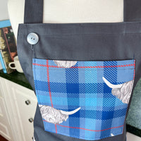 Highland Cows Make this Grey Apron Stand Out this Father's Day