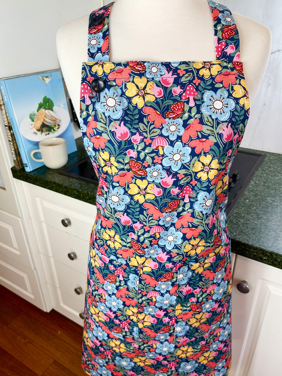 Hunt for the Adorable Butterflies and Mushrooms Within this Lovely Floral Apron
