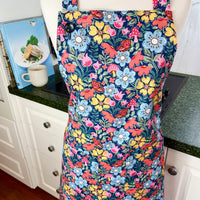 Hunt for the Adorable Butterflies and Mushrooms Within this Lovely Floral Apron