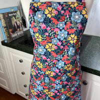 Hunt for the Adorable Butterflies and Mushrooms Within this Lovely Floral Apron