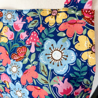 Hunt for the Adorable Butterflies and Mushrooms Within this Lovely Floral Apron