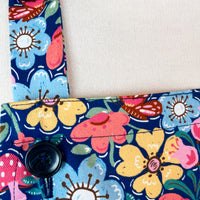 Hunt for the Adorable Butterflies and Mushrooms Within this Lovely Floral Apron