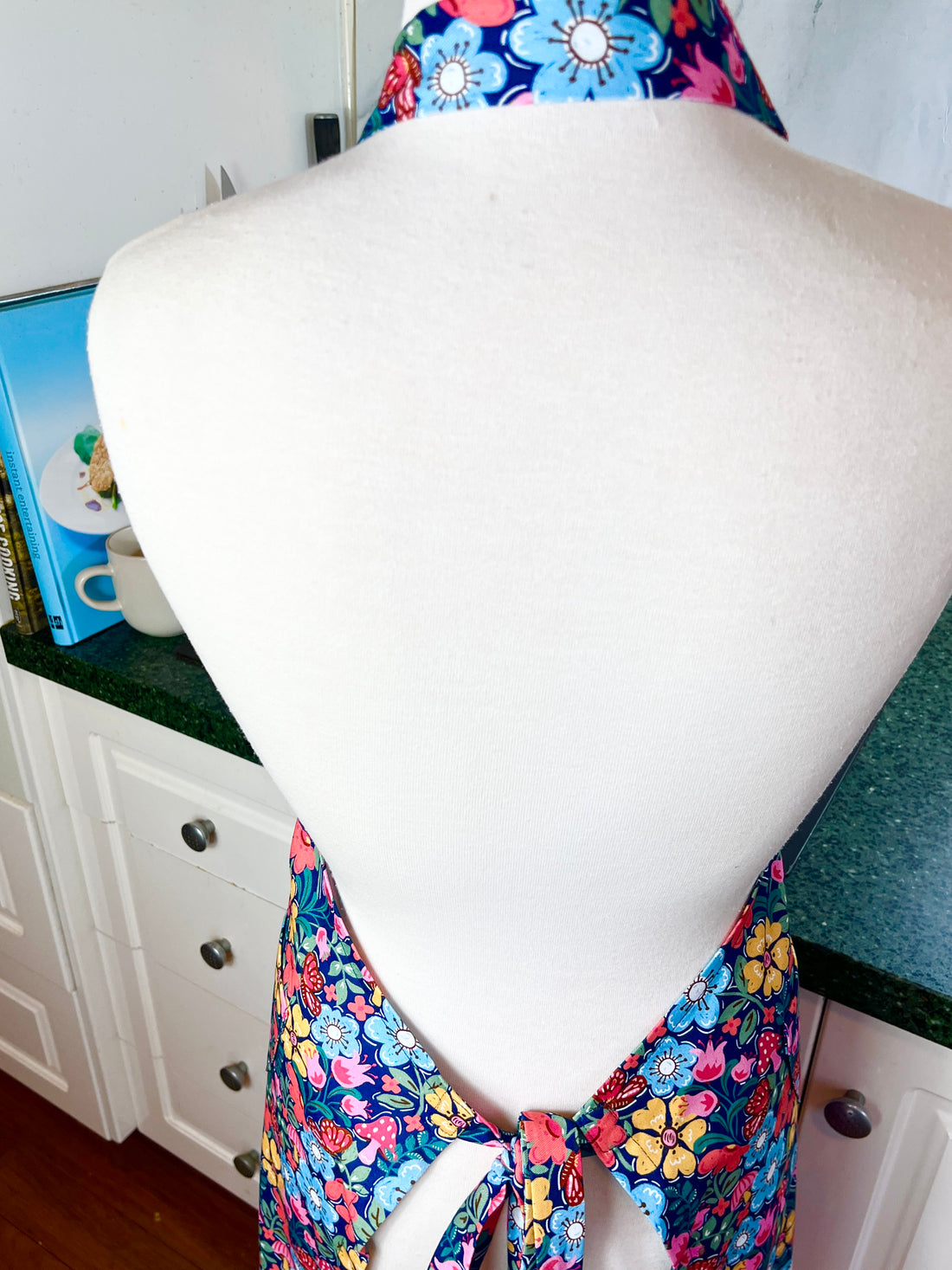 Hunt for the Adorable Butterflies and Mushrooms Within this Lovely Floral Apron
