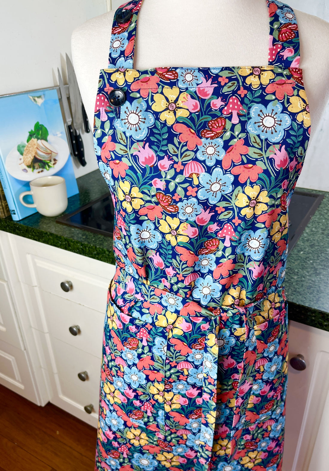 Hunt for the Adorable Butterflies and Mushrooms Within this Lovely Floral Apron