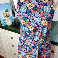 Hunt for the Adorable Butterflies and Mushrooms Within this Lovely Floral Apron