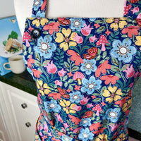 Hunt for the Adorable Butterflies and Mushrooms Within this Lovely Floral Apron