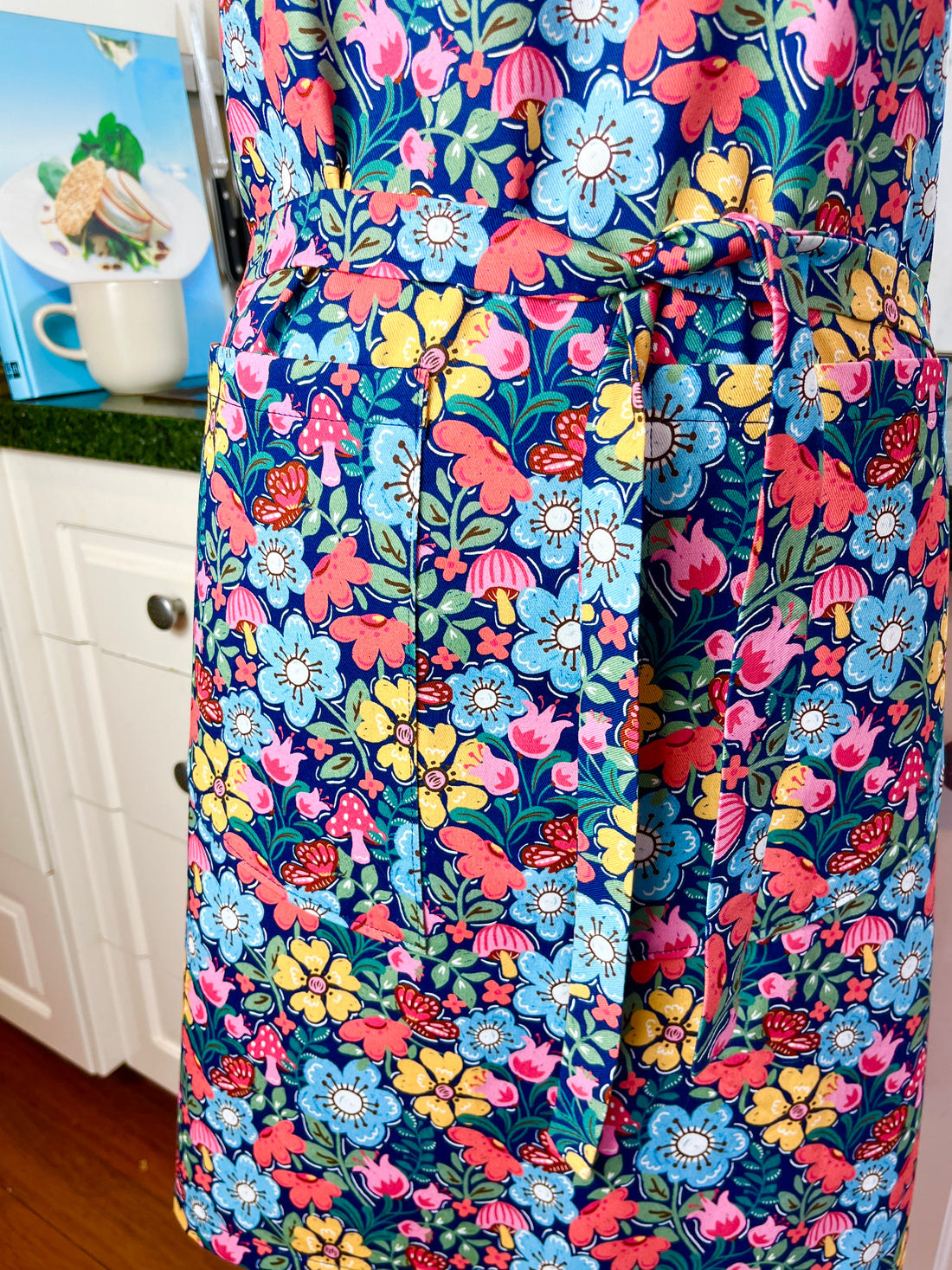 Hunt for the Adorable Butterflies and Mushrooms Within this Lovely Floral Apron