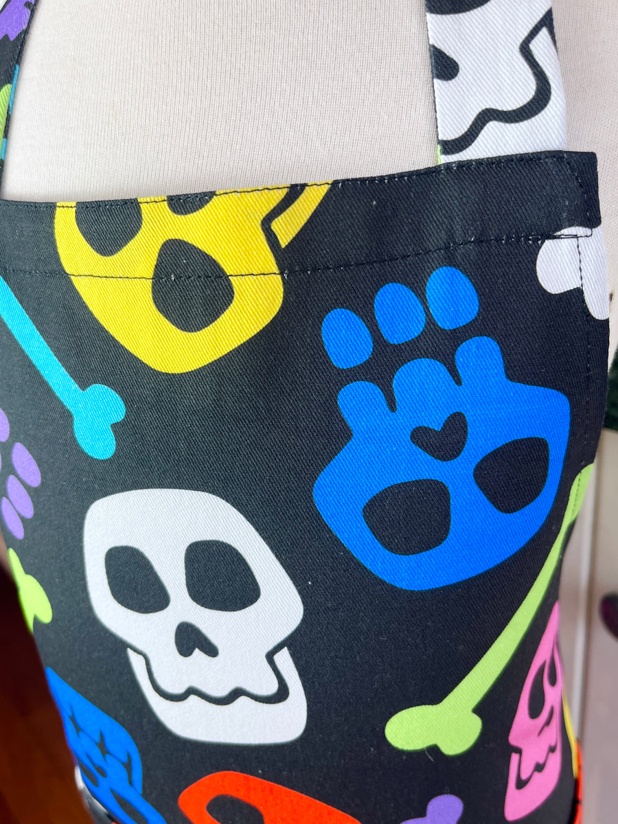 A Bright and Kooky Kid's Apron Covered in Bones
