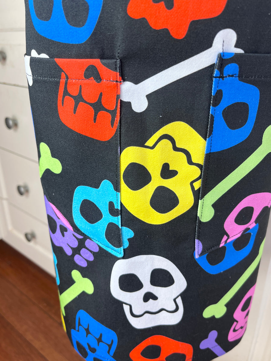 A Bright and Kooky Kid's Apron Covered in Bones