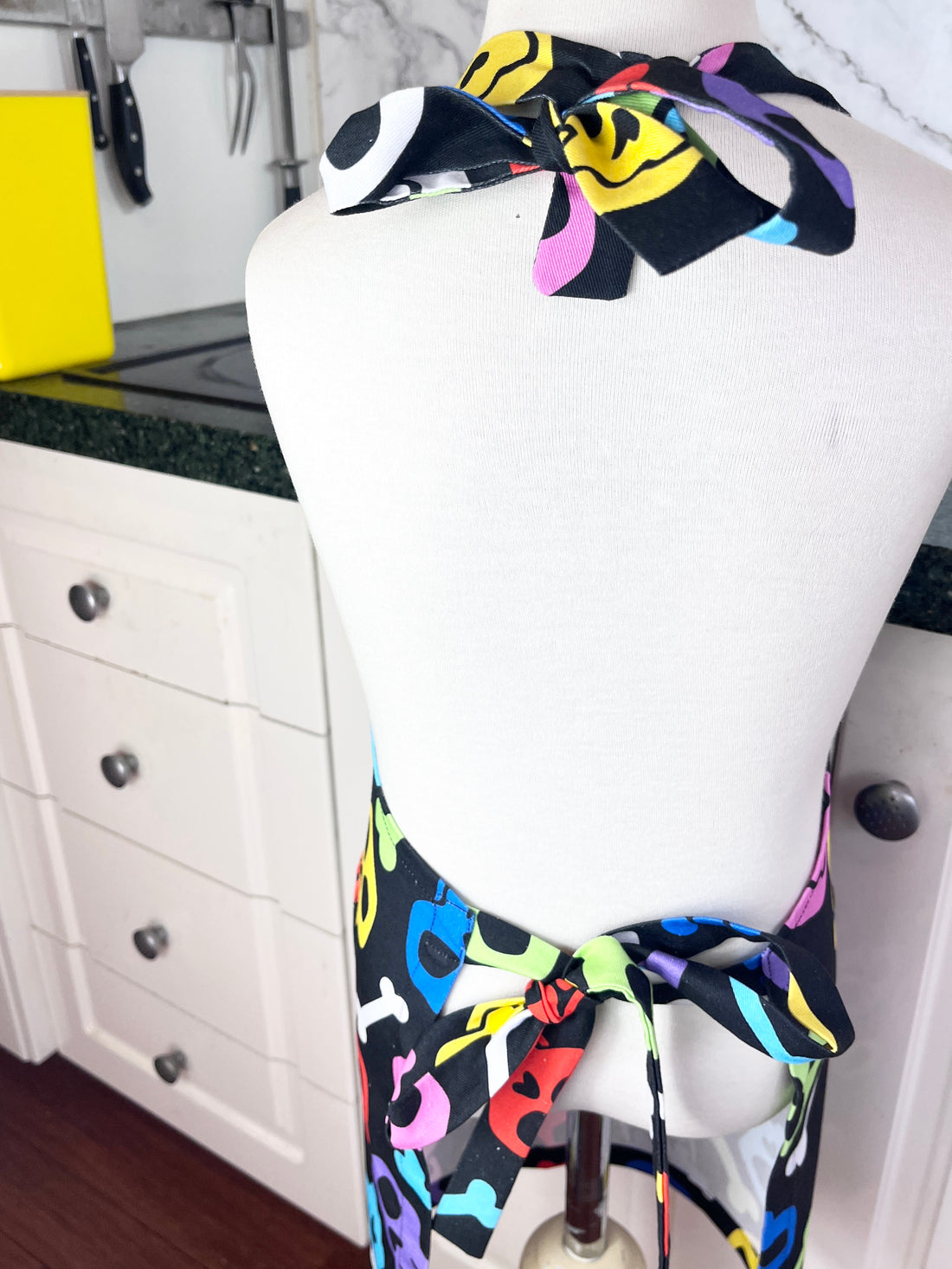A Bright and Kooky Kid's Apron Covered in Bones