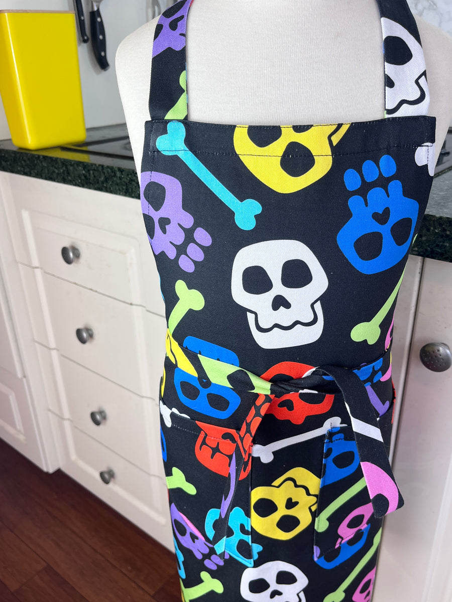 A Bright and Kooky Kid's Apron Covered in Bones