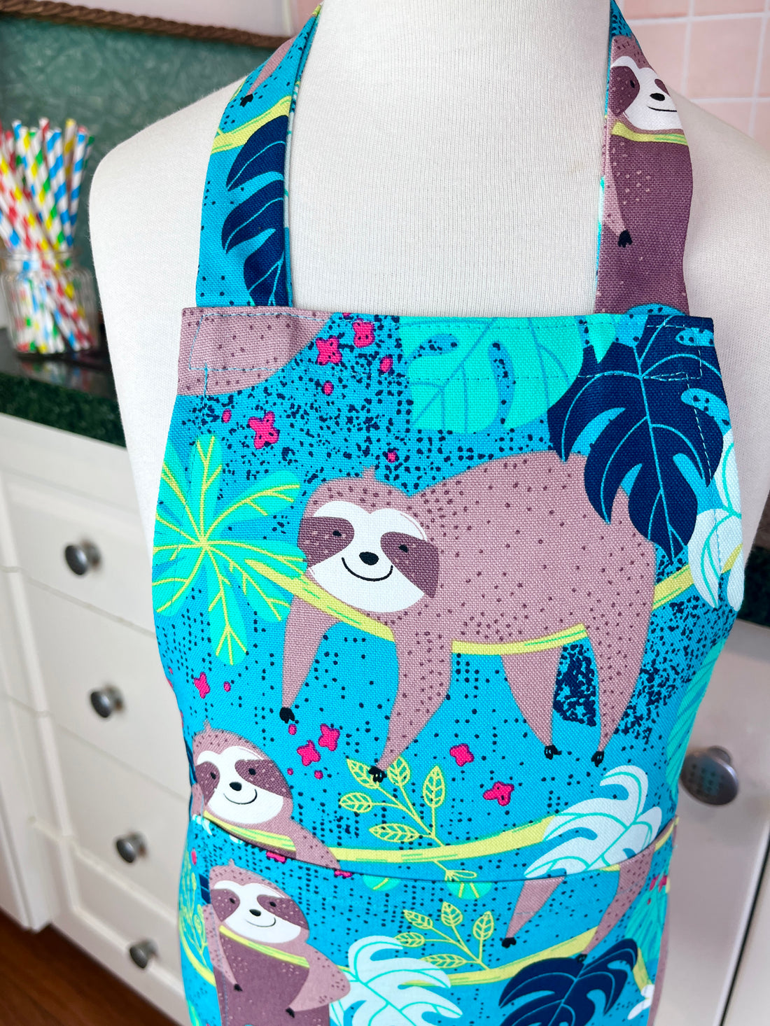 This Toddler's Apron is Covered in the Cutest Sloths