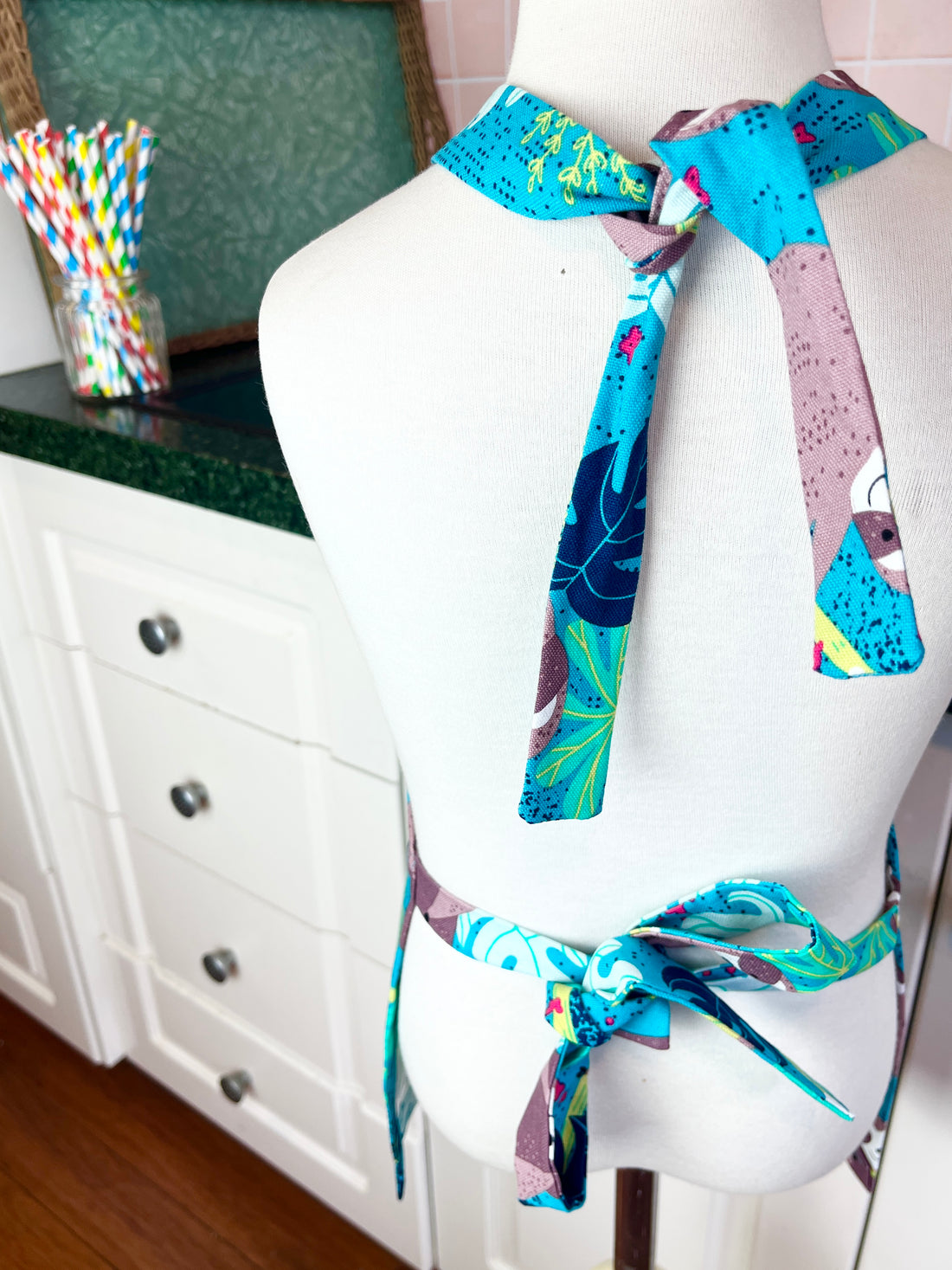 This Toddler's Apron is Covered in the Cutest Sloths