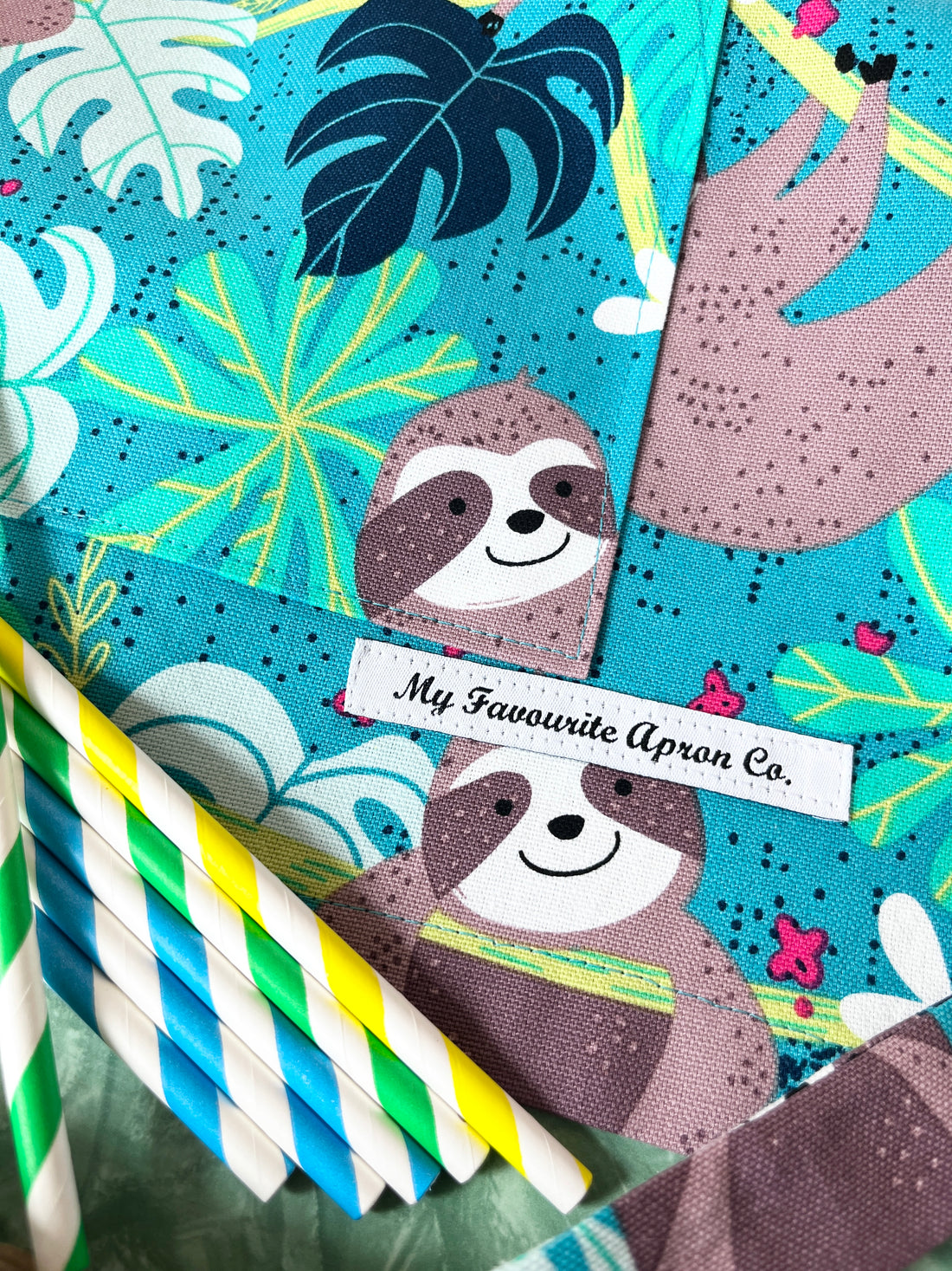 This Toddler's Apron is Covered in the Cutest Sloths